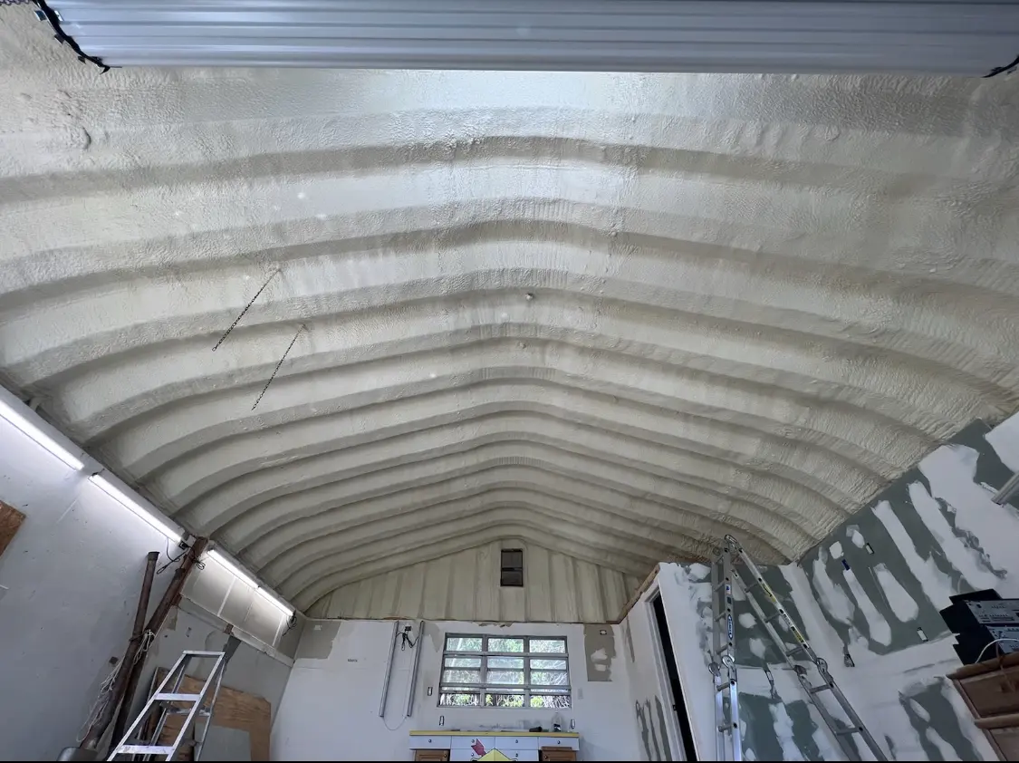 Spray polyurethane foam applied to the underside of a metal roof deck in Payson